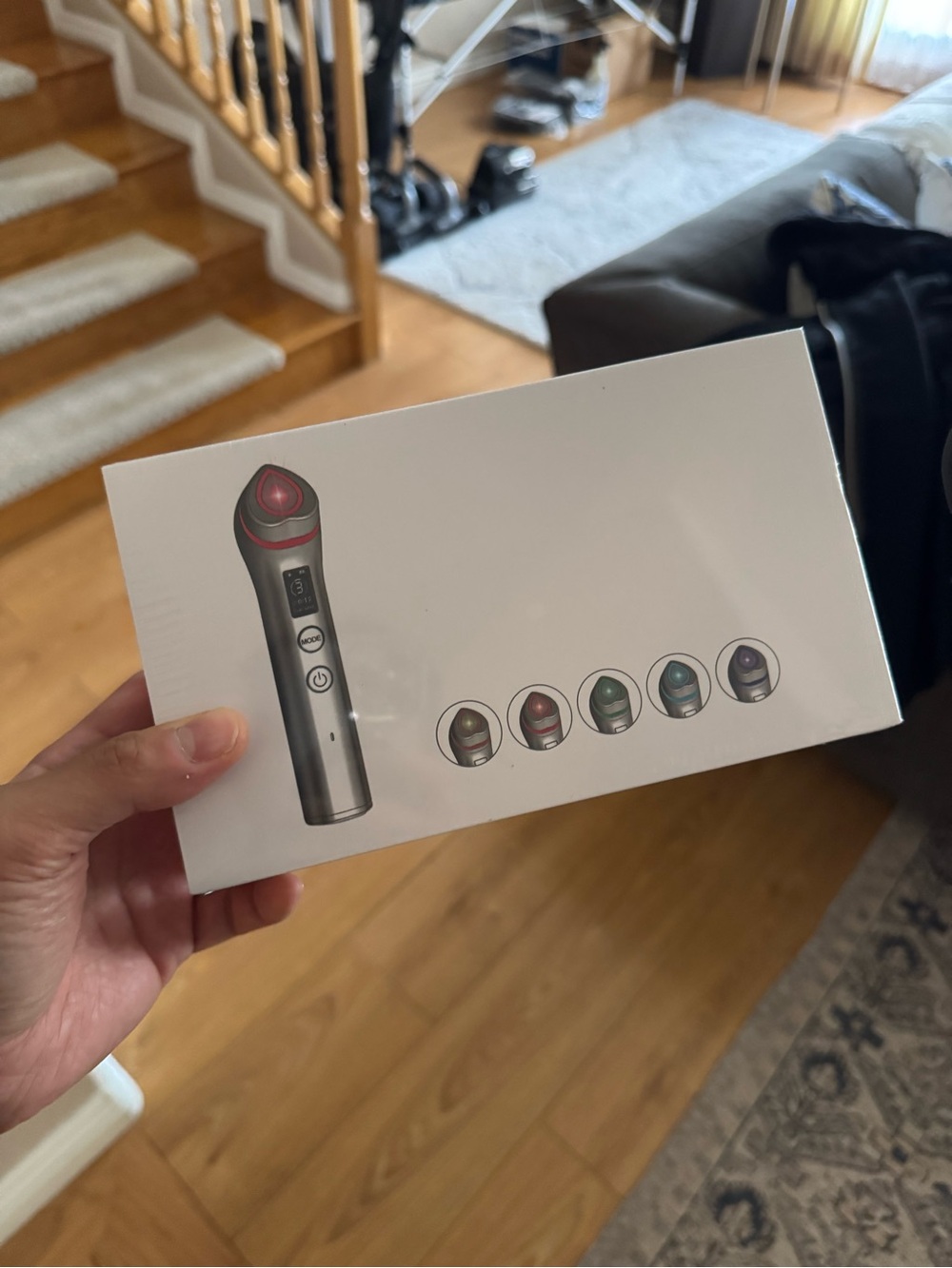 Handheld Facial Device with Red Accent
